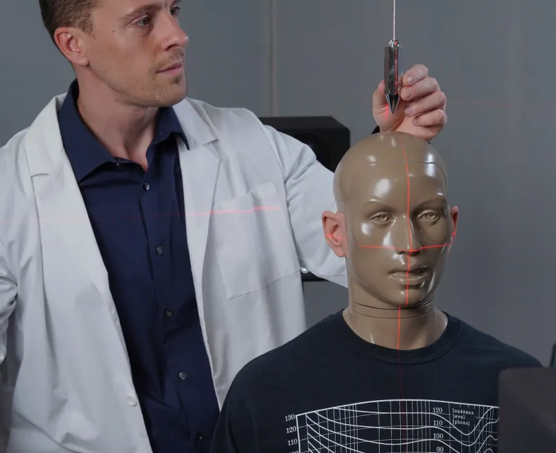 HearAdvisor engineer calibrating a hearing aid on a KEMAR manikin