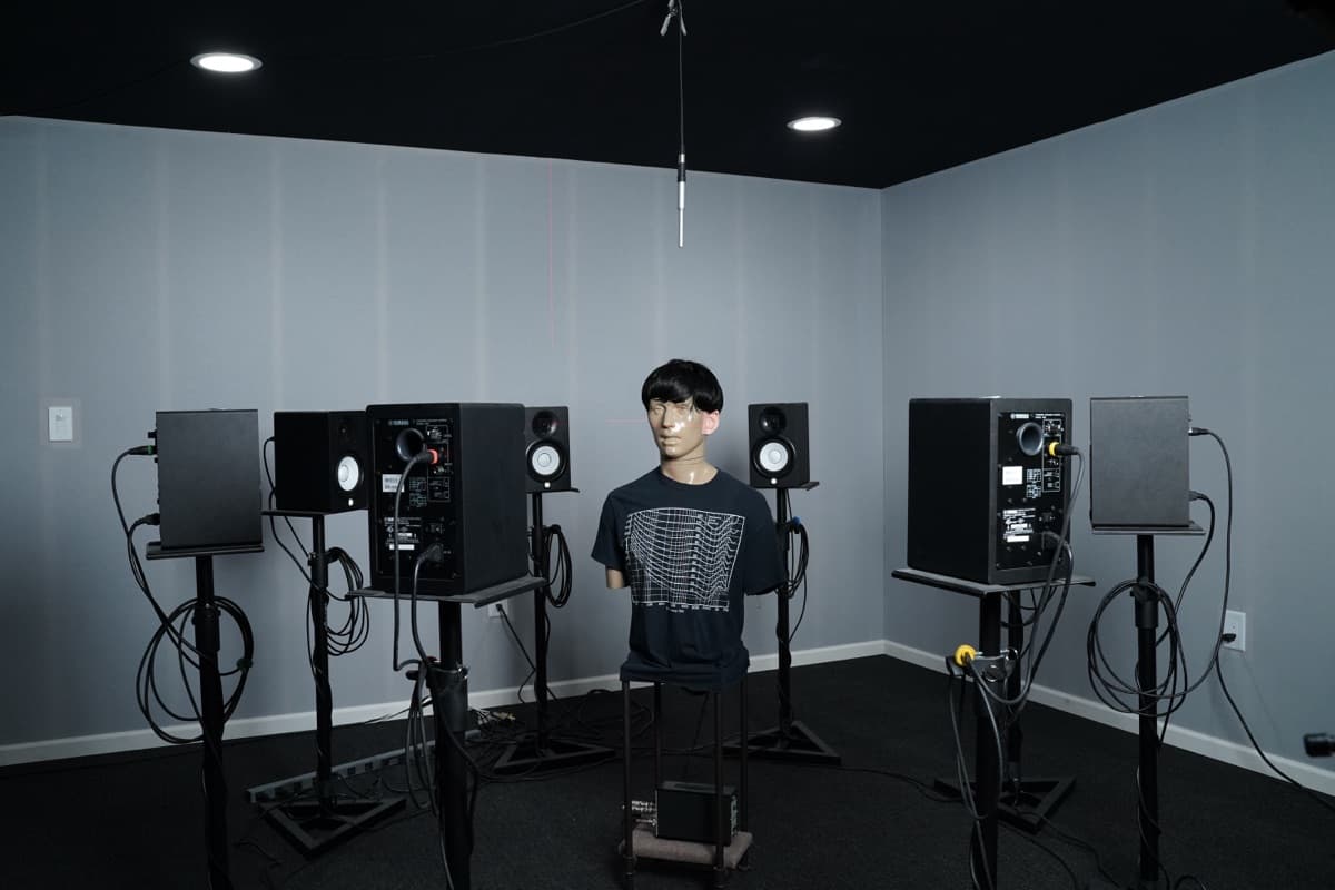 KEMAR manikin surrounded by 8-speaker ring in the HearAdvisor acoustic test lab